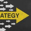 Strategy concepts with arrows on chalkboard background