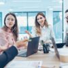 Professionals negotiating with one another in a meeting room